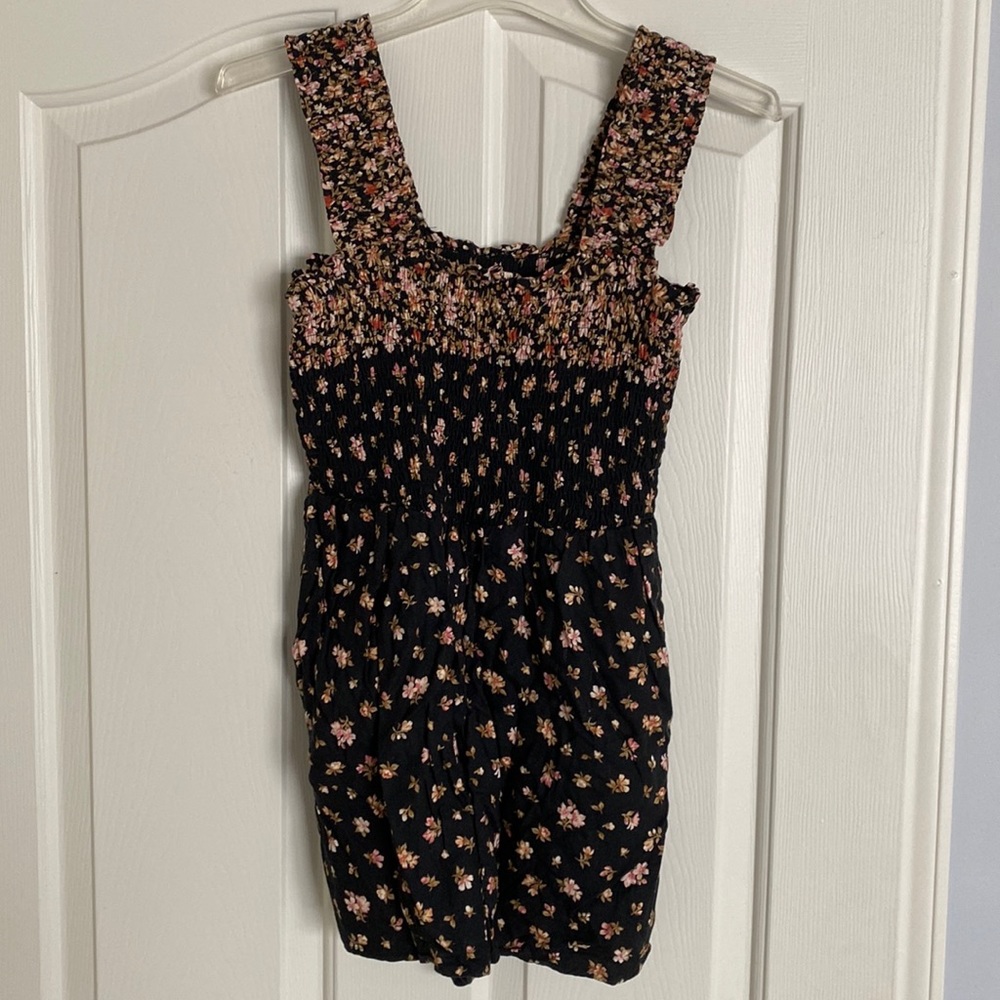 Short romper with pockets.  Top and straps are elastic, close up picture to see.